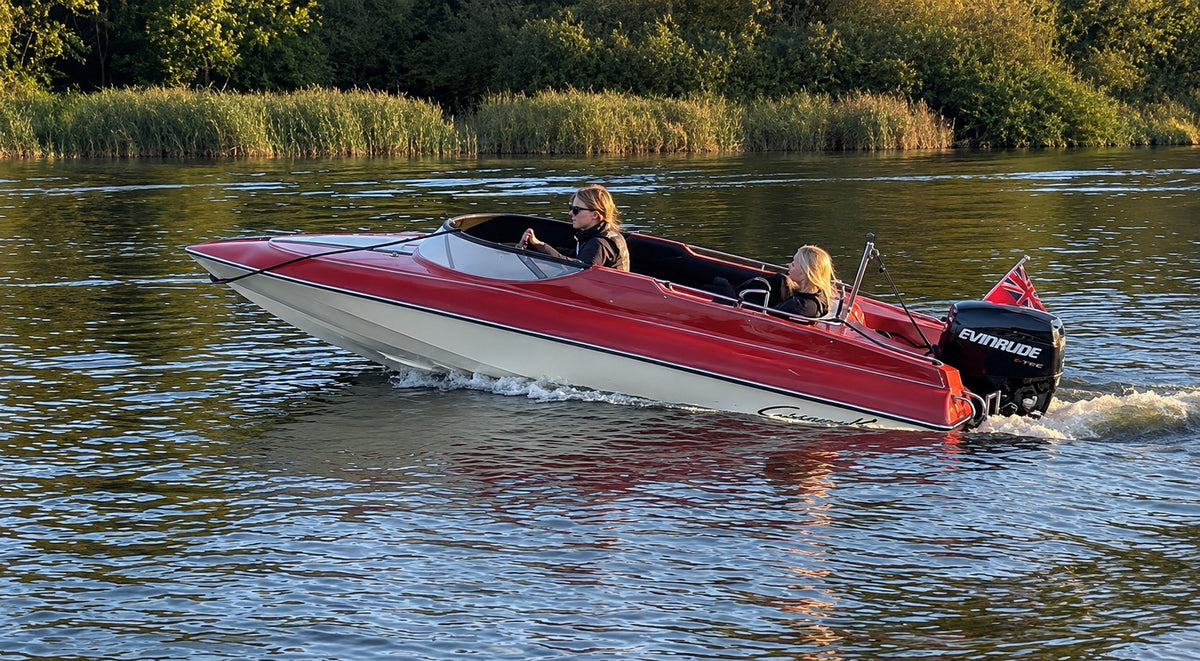 speedboat on the Norfolk broads being driven by powerboat racer Tom Thwaites 